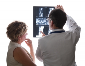 Doctor Viewing Scans With Patient